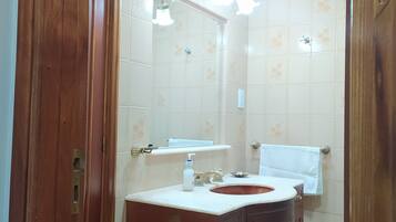 Shower, rainfall showerhead, hair dryer, towels
