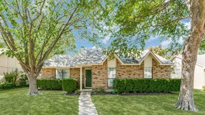 A two-story house with a brick facade, a front porch, and a well-maintained lawn. - Escape to Olivia's Hideaway in Allen! Close  to shopping,Eat, and entertainment (Allen)