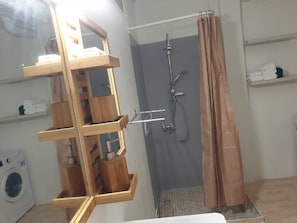 Shower, towels, soap, toilet paper