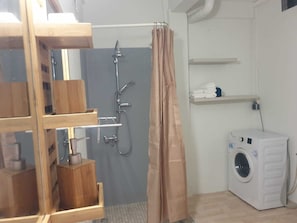 Shower, towels, soap, toilet paper