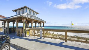 A beachside building with a wooden deck and a view of the ocean. - Amalfi Coast B219 * Scenic 98 near restaurants * Salt Water Vacations (Destin)