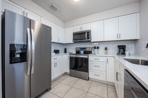 Fridge, microwave, oven, stovetop - Gulf Winds East #22 | by Salt Water Vacations (Destin)