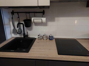 Fridge, cookware/dishes/utensils, dining tables