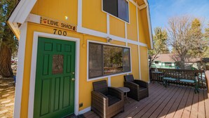 A yellow building with a green door and the number 700. - The Love Shack (Sugarloaf)
