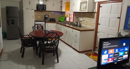 Caribbean house 3 mins walk to the marina and port.