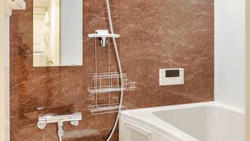 Bathtub, hair dryer, towels, soap