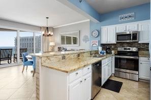 Fridge, microwave, oven, stovetop - Tops'l Tides #1008 | by Salt Water Vacations (Destin)