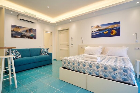 Chambre Deluxe | Minibar, coffre-fort, ameublement unique, bureau