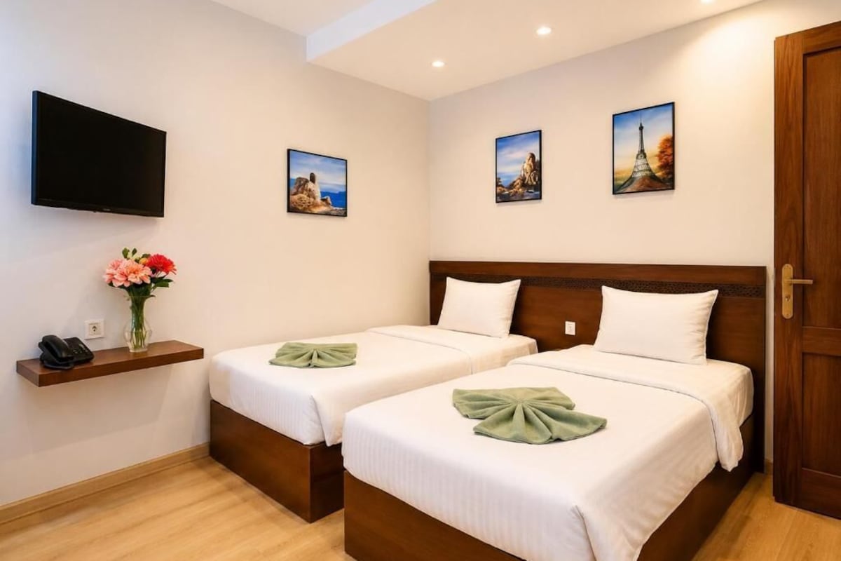 Kamar Double atau Twin Deluks | Seprai katun Mesir, seprai premium, dan minibar