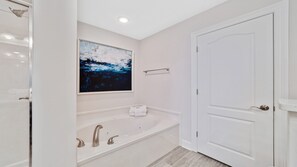 Shower, jetted tub, towels