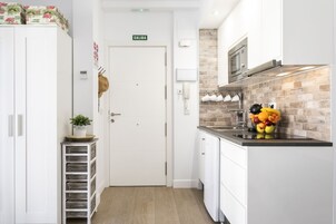 Mini-fridge, microwave, stovetop, coffee/tea maker