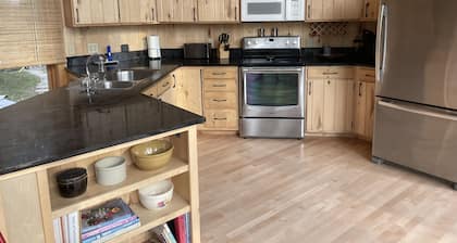 The newly remodeled Stone Cabin with sandy beach and clean clear water