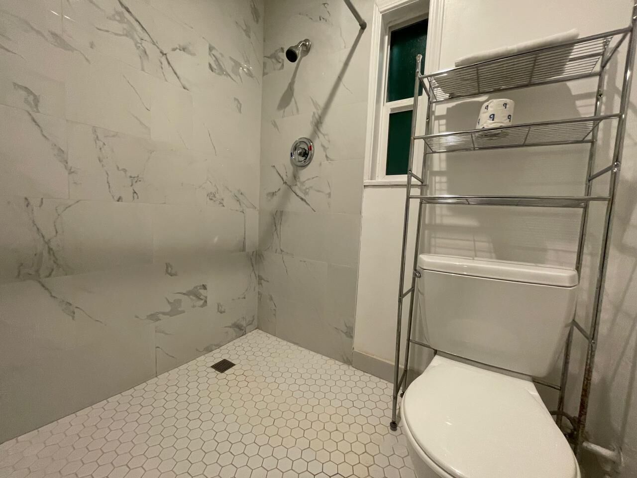 Shower, hair dryer, towels, toilet paper