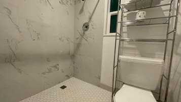 Shower, hair dryer, towels, toilet paper