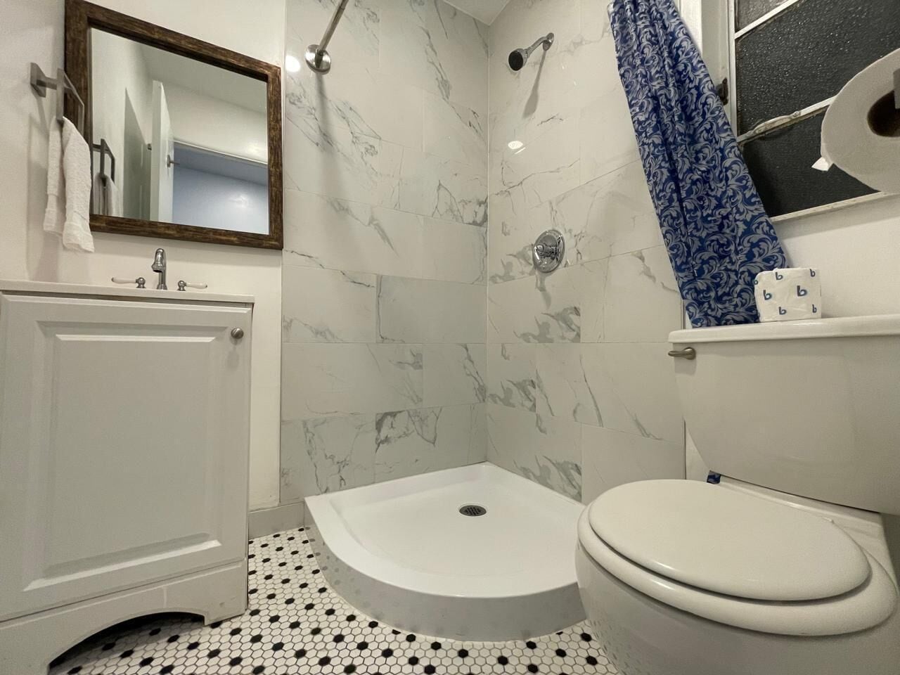 Shower, hair dryer, towels, toilet paper