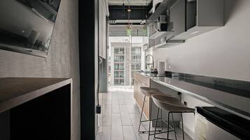 Fridge, microwave, stovetop, coffee/tea maker