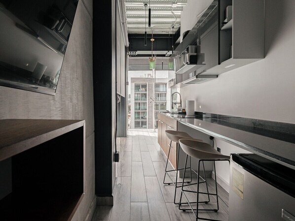 Fridge, microwave, stovetop, coffee/tea maker