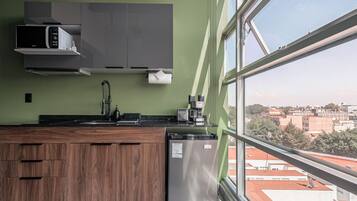 Fridge, microwave, stovetop, coffee/tea maker