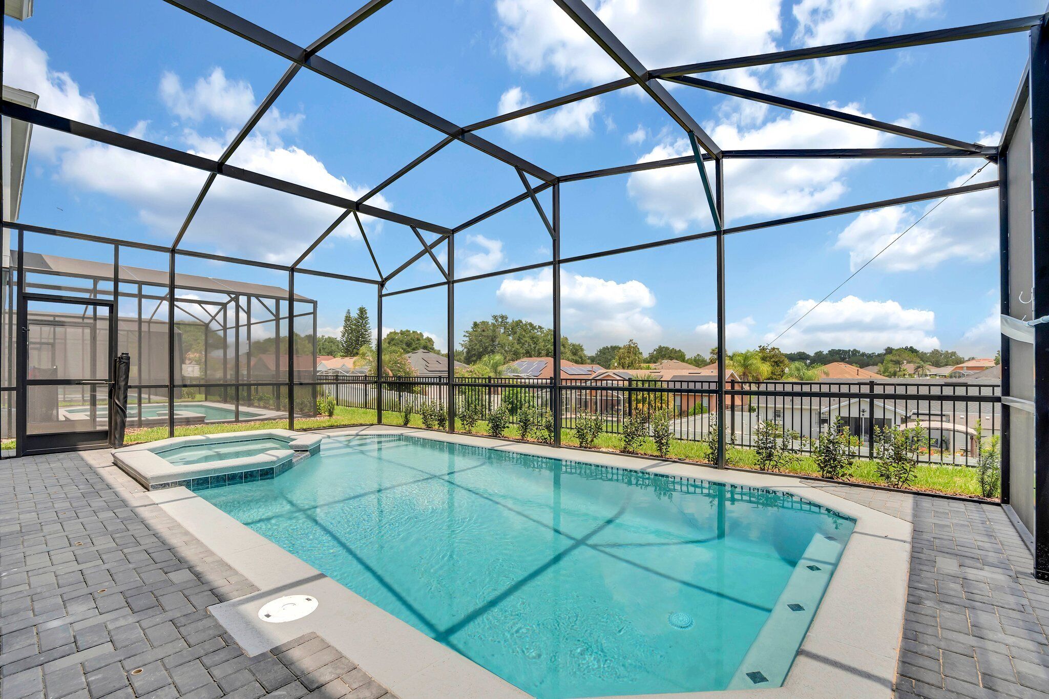 Your private pool and spa — no rear neighbors, just your group and the Florida sky.