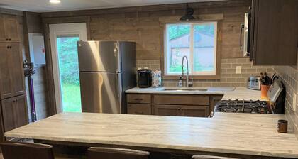 Minutes to town or very peaceful woods retreat! Close to trails and golf.