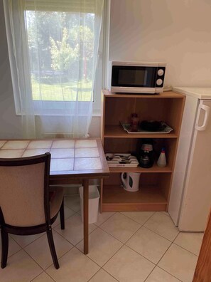 Fridge, microwave, stovetop, coffee/tea maker