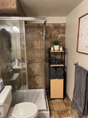 Shower, hair dryer, towels, soap