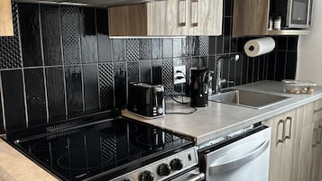 Fridge, microwave, toaster oven, cookware/dishes/utensils