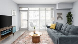 Apartment | Living area | 43-inch Smart TV with digital channels, TV, Netflix - CozySuites TWO Stylish Apts Monument Cir (Indianapolis)