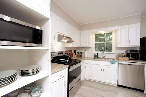 Fridge, coffee/tea maker, highchair, cookware/dishes/utensils