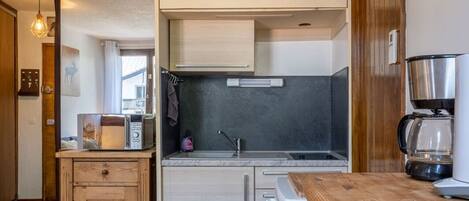 Fridge, microwave, coffee/tea maker, toaster
