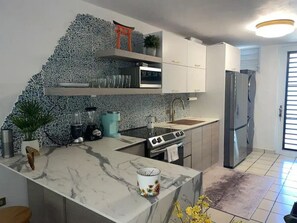 Fridge, microwave, stovetop, coffee/tea maker