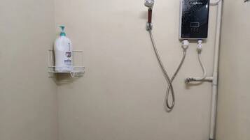Shared Dormitory | Bathroom | Shower, towels, soap, shampoo