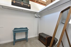 A room with a blue table, a trunk, and a wooden ladder. - The Glass Ceiling 360 degree Mount View Hideaway (Mount View)