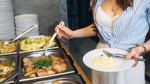 A buffet with various food options, including roasted potatoes and meats. - Mielno Hotel Boutique (Mielno)
