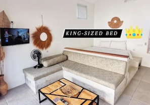 Relax in this inviting space with a king-sized bed and flat-screen TV.