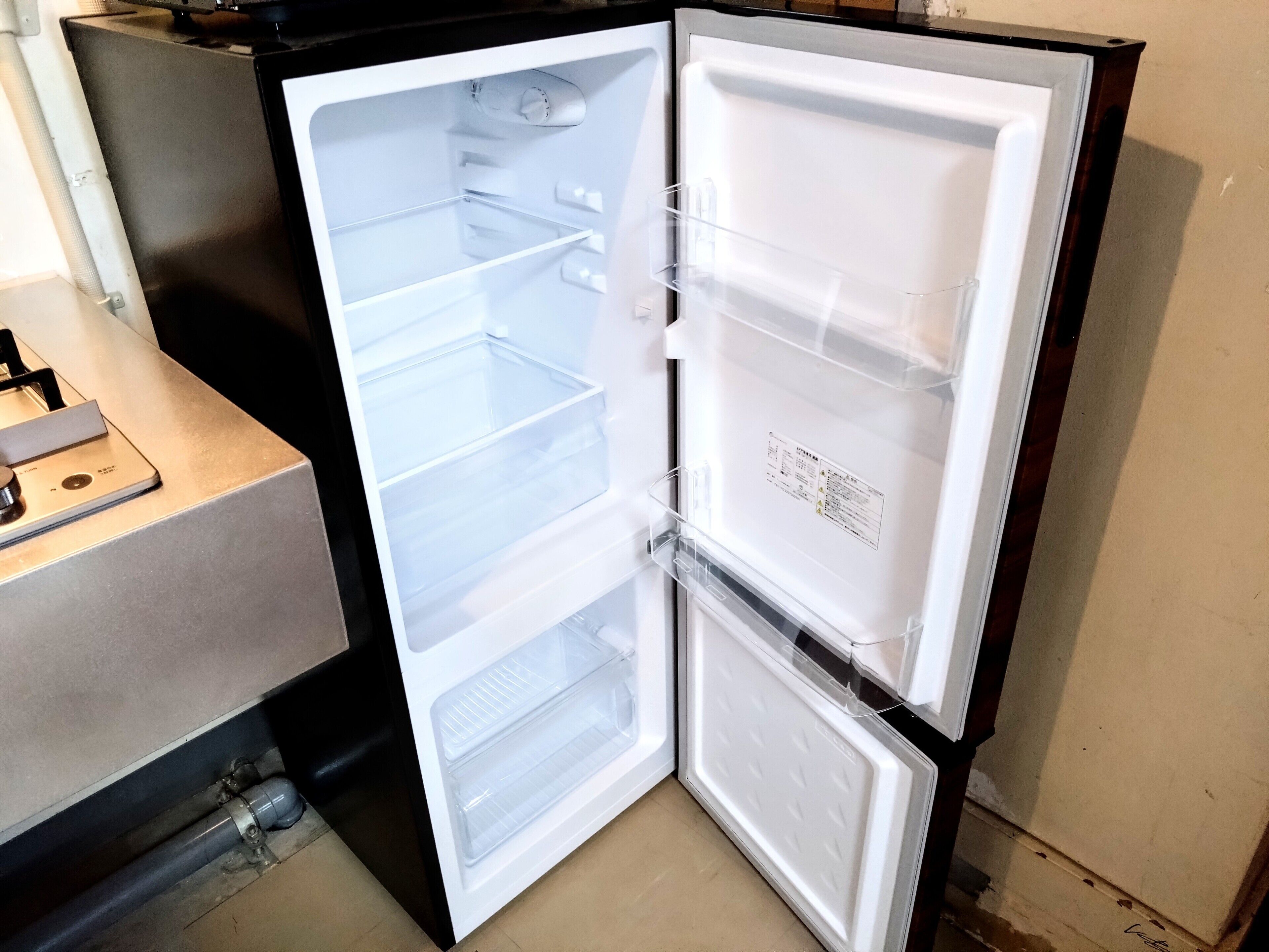 A refrigerator with multiple shelves and a freezer compartment.