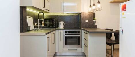 Apartment | Private kitchen | Full-size fridge, oven, dishwasher, toaster