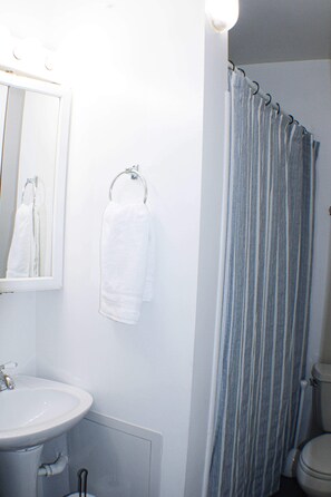 Bathtub, hair dryer, towels