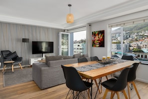 Exclusive Apartment | Living area | 40-inch flat-screen TV with cable channels, TV, Netflix