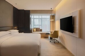 Luxe beddengoed, donsdekens, pillowtop-bedden, een minibar