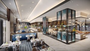 A modern hotel lobby with a central bar area, seating arrangements, and a patterned floor. - Crowne Plaza Ganzhou by IHG (Ganzhou)