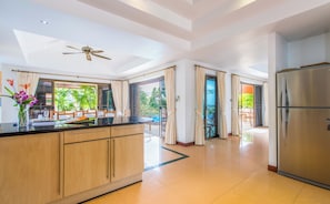 Enjoy cooking in this well-equipped kitchen with a central island and ample workspace.