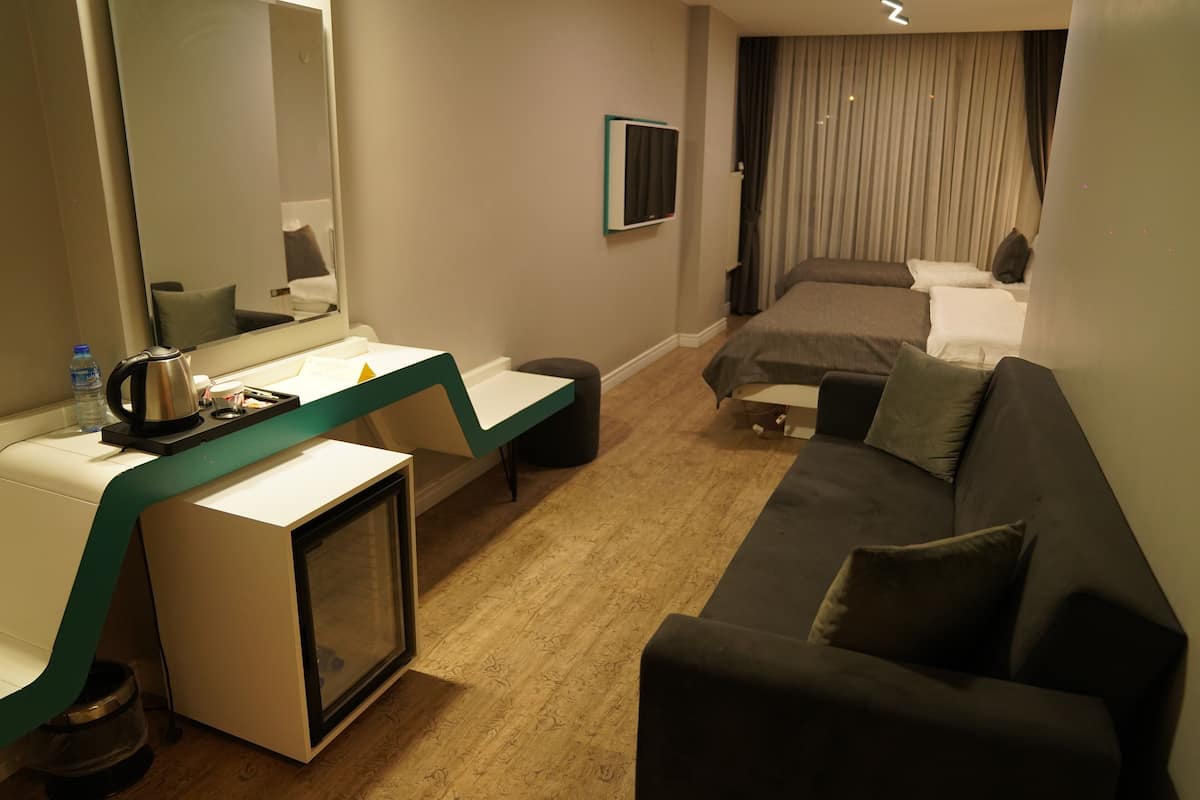 Family Quadruple Room, 1 Bedroom, Air conditioning, City View | Premium bedding, free minibar, in-room safe, desk