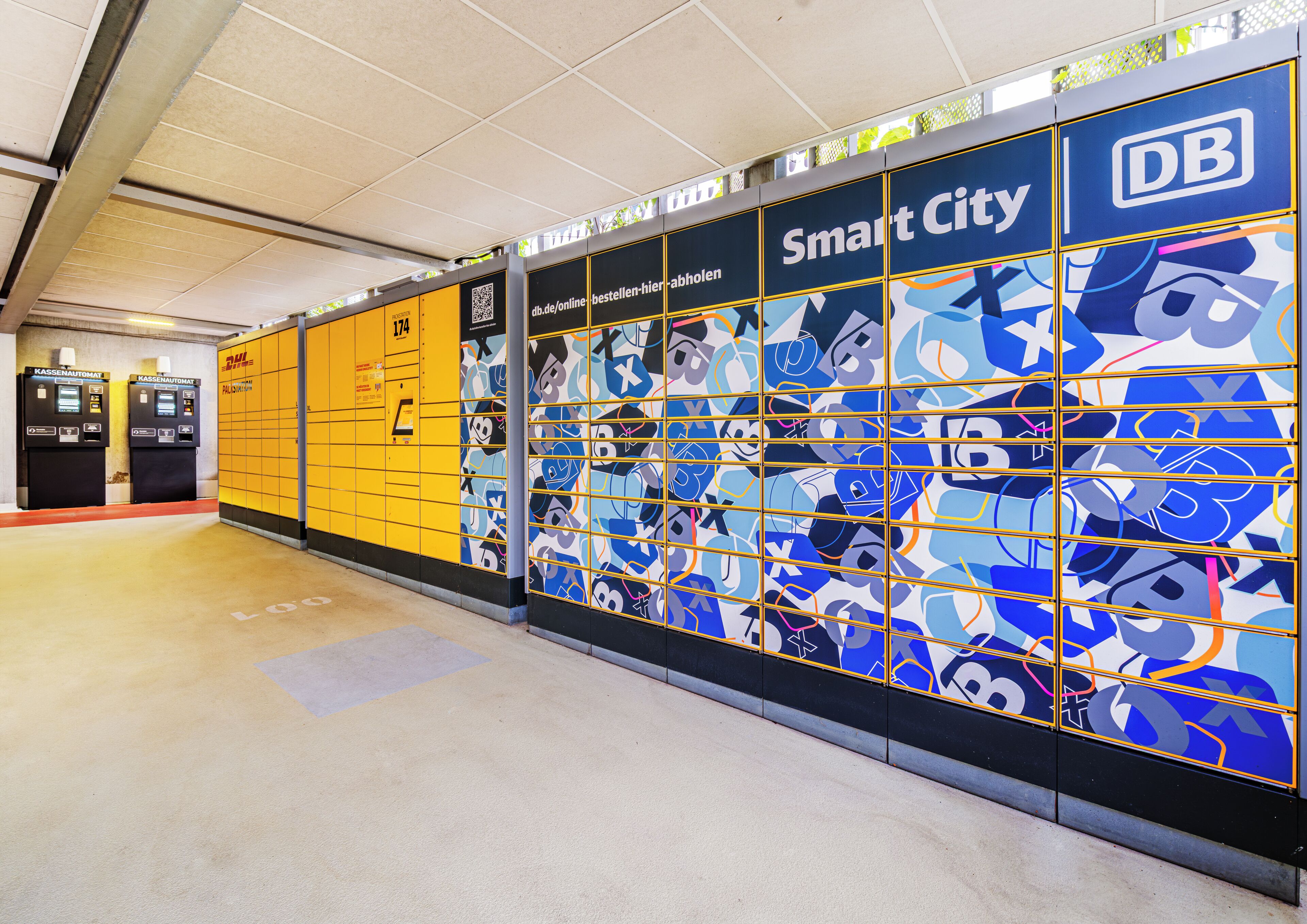A subway station with yellow lockers, a 'Smart City' mural, and a DB logo.