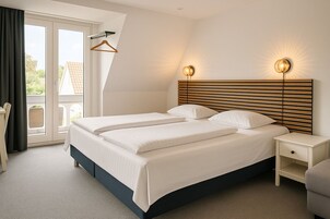 Habitación doble, baño compartido | Cortinas opacas, wifi gratis, ropa de cama