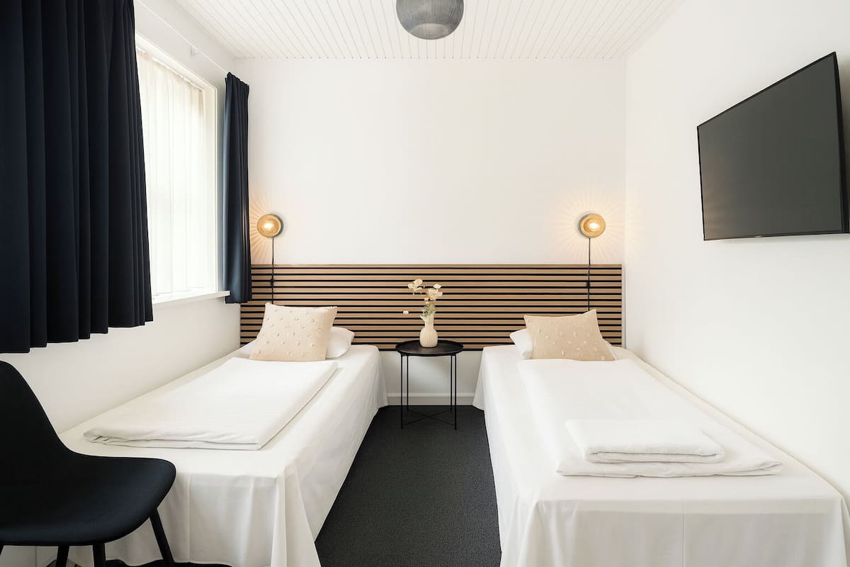 Twin Room, Shared Bathroom | Blackout drapes, free WiFi, bed sheets