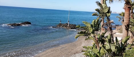 On the beach, white sand, 2 beach bars