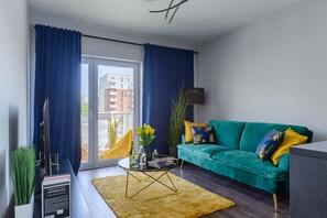 City Apartment | Desk, blackout drapes, iron/ironing board, cribs/infant beds