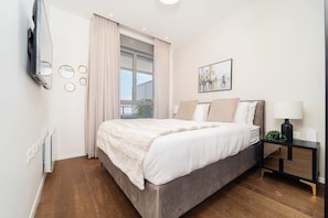 1 bedroom, desk, iron/ironing board, travel crib