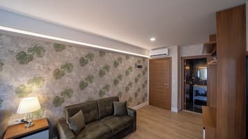 Deluxe Triple Room, 1 King Bed with Sofa bed | In-room safe, desk, soundproofing, iron/ironing board